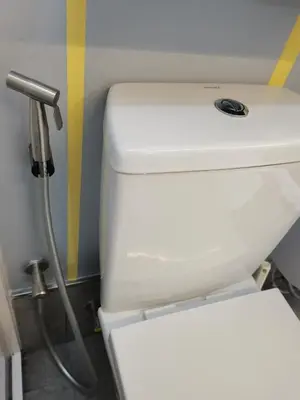 a white toilet in a bathroom with a shower at Ampang Hilir KL City Boutique Residence in Kuala Lumpur