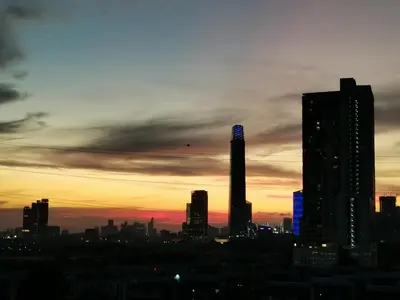 a view of a city skyline at sunset at Ampang Hilir KL City Boutique Residence in Kuala Lumpur