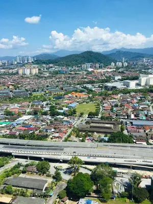 an aerial view of a city with a highway at The Harmony at Astoria Ampang - Mountain View in Kuala Lumpur