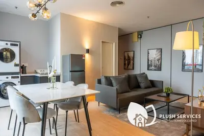 a living room with a table and a couch at Bangsar Trade Centre in Kuala Lumpur