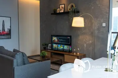 a living room with a television and a table at Bangsar Trade Centre in Kuala Lumpur
