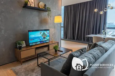 a living room with a couch and a television at Bangsar Trade Centre in Kuala Lumpur