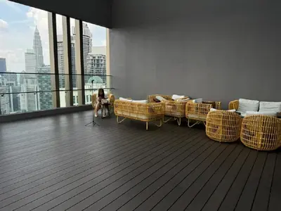 a room with couches and a dog sitting on a floor at AXON SUITE aT BUKIT BINTANG KL near Pavillion in Kuala Lumpur