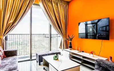 a living room with orange walls and a large window at Platz @ KL North Setapak by Airhost in Kuala Lumpur