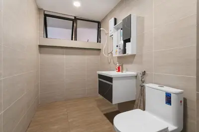 a bathroom with a toilet and a sink at Plaza Berjaya Apt Bukit Bintang With 3 Bedroom in Kuala Lumpur