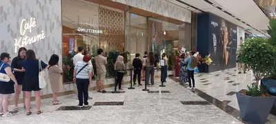 a group of people standing outside of a store at Plaza Berjaya Apt Bukit Bintang With 3 Bedroom in Kuala Lumpur