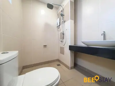 a bathroom with a white toilet and a sink at Rafflesia Condominium Sentul by Beestay in Kuala Lumpur