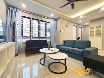 a living room with a couch and a table at Rafflesia Condominium Sentul by Beestay in Kuala Lumpur