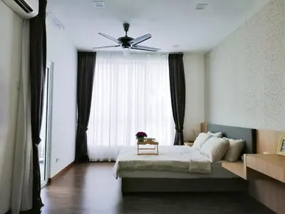 a bedroom with a bed and a ceiling fan at Setapak Central Signature Suites by Manhattan Group in Kuala Lumpur