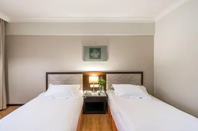 two beds sitting next to each other in a room at Crystal Crown Hotel Kuala Lumpur in Kuala Lumpur
