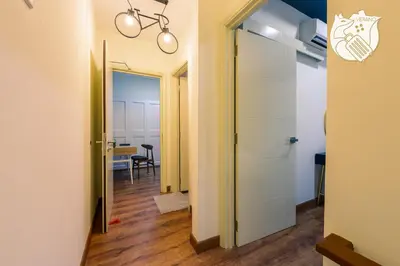 a hallway with a door leading to a dining room at Luxury Duplex Condo Retreat-Corner v 2 Parking, KL by Verano in Kuala Lumpur