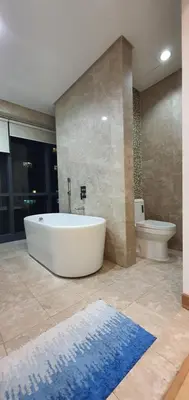 a large bathroom with a tub and a toilet at The Elements @ Ampang in Kuala Lumpur