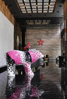 a room with a pink and white horse on display at Star residance at Klcc - Two bedrooms with twin towers view in Kuala Lumpur