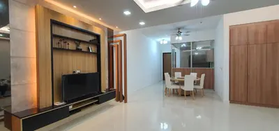 a living room with a television and a dining room at The Elements Ampang Infinity Pool in Kuala Lumpur