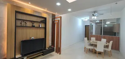 a dining room with a television and a table and chairs at The Elements Ampang Infinity Pool in Kuala Lumpur