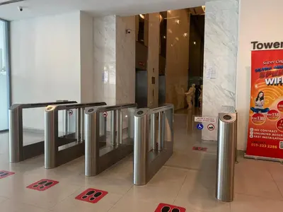 a lobby with a row of silver trash cans at Summer Suites Apartment 7min walk to KLCC by GRIHOZ in Kuala Lumpur