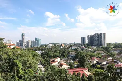 a cityscape of a city with tall buildings at KL Townhouse Villa by LilyandLoft in Kuala Lumpur