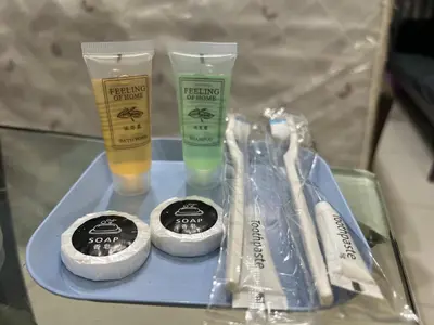 a tray with two bottles of cleaning products on a table at Chambers Couple studio Klcc in Kuala Lumpur