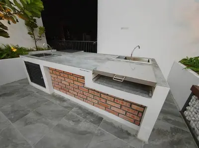 a bathroom with a sink on top of a brick wall at Chambers Residence by FANTASTIC in Kuala Lumpur