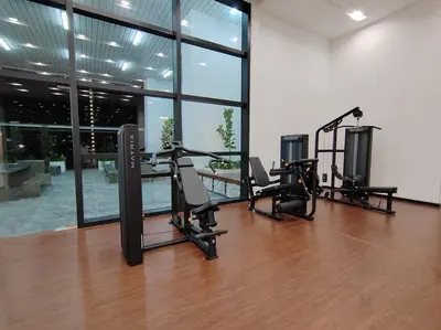 a gym with two treadmills and ellipticals in a building at Chambers Residence by FANTASTIC in Kuala Lumpur