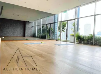a large room with a large room with a large floor to ceiling windows at Aletheia Studio at KLCC in Kuala Lumpur
