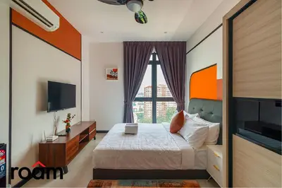 a bedroom with a bed and a large window at Neu Suites Residence, Embassy Row in Kuala Lumpur