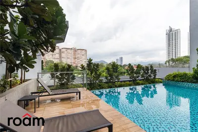 a swimming pool on the roof of a building at Neu Suites Residence, Embassy Row in Kuala Lumpur