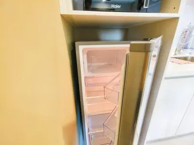 an open refrigerator with its door open in a kitchen at Chambers Service Suites Amazing View KLCC in Kuala Lumpur