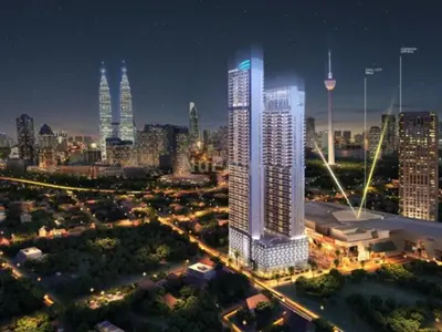a city skyline at night with a tall building at Penthouse Sky Jacuzzi At KLCC in Kuala Lumpur