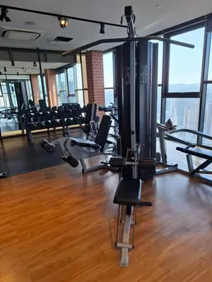 a gym with chairs and treadmills in a building at Ceylonz Suites By ANA MALAYSIA in Kuala Lumpur