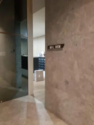 a lobby with a sign on the wall of a building at Suasana Homestay Kewingston Platz in Kuala Lumpur