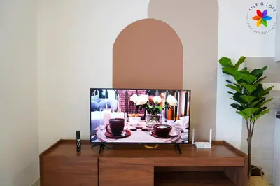 a tv sitting on a dresser in a living room at The Pano @ Jalan Ipoh by Lily and Loft in Kuala Lumpur