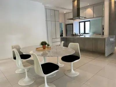 a kitchen with a table and chairs in a kitchen at Bungalow with Pool Karaoke PJ 12 in Petaling Jaya