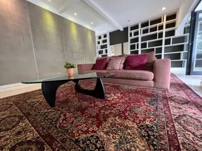 a living room with a pink couch and a glass table at Bungalow with Pool Karaoke PJ 12 in Petaling Jaya