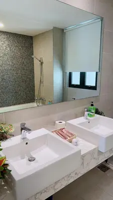 a bathroom with two sinks and a large mirror at TheOoak suite 4pax cozy home stay @mont kiara in Kuala Lumpur