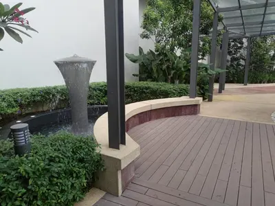 a fountain in the middle of a building with a patio at TheOoak suite 4pax cozy home stay @mont kiara in Kuala Lumpur
