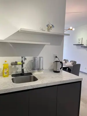 a kitchen with a sink and a counter top at 100Mbps DesaPark MontKiara Publika Mitec Kepong Menjalara Segambut 7Pax in Kuala Lumpur