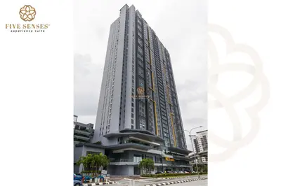 a tall building in the middle of a city at Neu Suites Residence Kuala Lumpur, Roam in Kuala Lumpur