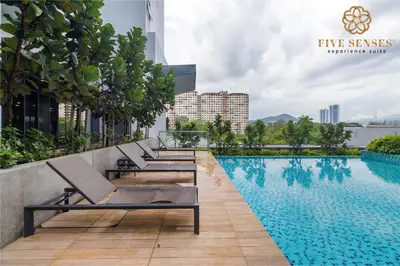 a hotel swimming pool on the roof of a building at Neu Suites Residence Kuala Lumpur, Roam in Kuala Lumpur