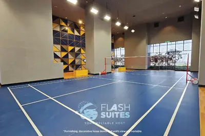 a gym with a tennis court in the middle at Trion Premium Suites @ KL in Kuala Lumpur