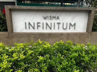 a sign for a museum in a building at Relax Bedroom Studio, The Luxe in Kuala Lumpur