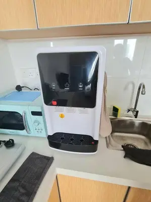 a microwave sitting on a kitchen counter next to a sink at 2R2B Apartment 10 mins to KLCC in Kuala Lumpur