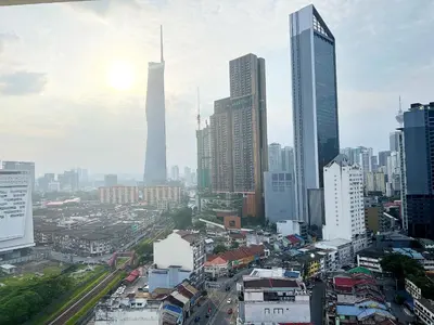 a city skyline with skyscrapers in a city at Infini Suites@ D'Majestic Place Kuala Lumpur in Kuala Lumpur