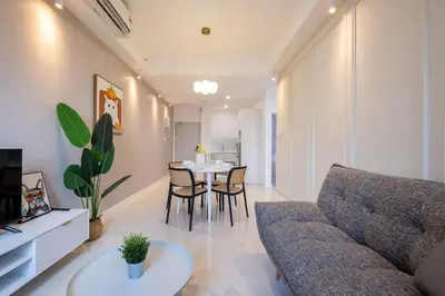 a living room with a couch and a table at Chambers near PWTC SunwayPutra KLCC InfinityPool in Kuala Lumpur