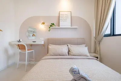 a small bedroom with a bed and a desk at Chambers near PWTC SunwayPutra KLCC InfinityPool in Kuala Lumpur