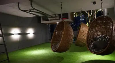 a room with three hanging baskets on a green floor at Ceylonz Suite, Bukit Bintang by MK HOME in Kuala Lumpur
