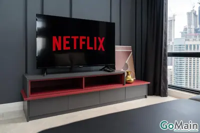 a television on a red entertainment center in a room at Axon Bukit Bintang Pavillion KL KLCC by GoMain in Kuala Lumpur