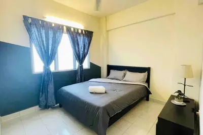 a bedroom with a large bed with a window at 3BR 8PAX KL City Centre KLCC View Ampang Boulevard Condo in Ampang