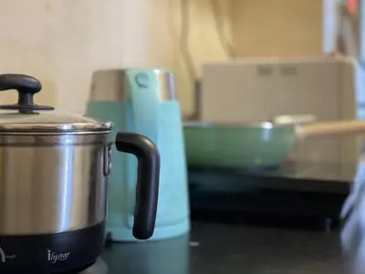a pot sitting on a counter next to a mixer at 3BR 8PAX KL City Centre KLCC View Ampang Boulevard Condo in Ampang
