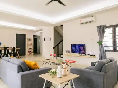 a living room with two couches and a table at The 29 Bungalow Setapak KL by Manhattan Group in Kuala Lumpur